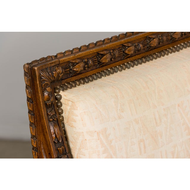 A refined late 19th century French Louis XVI style canapé, sourced in Rochefort, France and structurally revised in our...