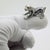 Capturing the endearing energy and charm of a young canine, this vintage silver figurine depicts a playful puppy dog....