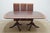 Dining Table by Henkel Harris. Store item #562. It features banded top and comes with protective pads and three leaves...