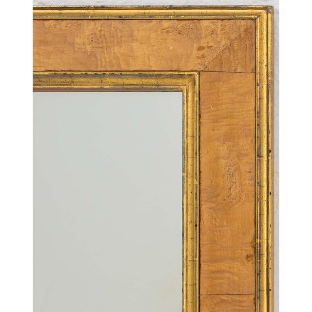 Modern Birch Wood and Gilt Gesso Framed Mirror. Mirror plate: 47.5" H x 29.25" W; frame: 54.5" H x 36.25" W x 1.5" D....