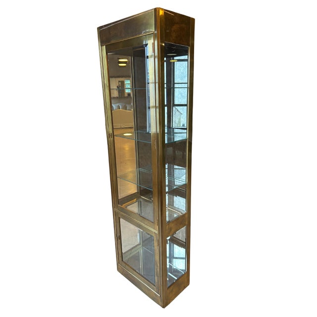 This exceptionally rare Mastercraft brass vitrine showcases the renowned craftsmanship and glamorous aesthetic that define...