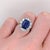 A gorgeous art deco style ring featuring an emerald cut tanzanite with a rich blue color that can compete with a stunning...
