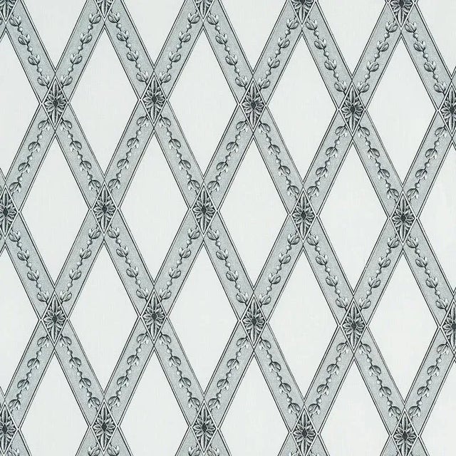 Painstakingly made to resemble an antique etching, this pared-down trellis and lozenge motif has all the precision and...