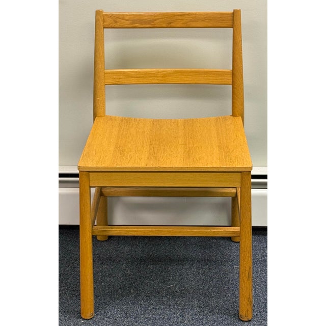 Beautiful set of six oak dining chairs featuring clean, contemporary lines and a warm blonde oak finish. Each chair...