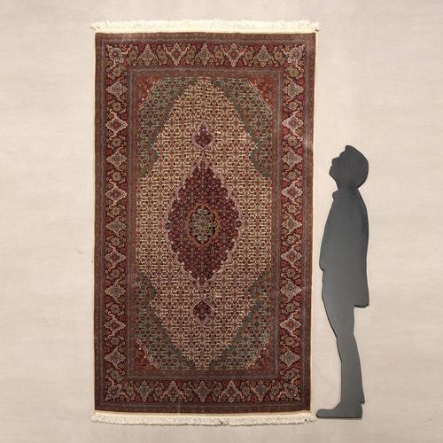Mud rug in cotton, wool and silk, fine knot, hand-made. In good condition. This piece is attributed to the mentioned...
