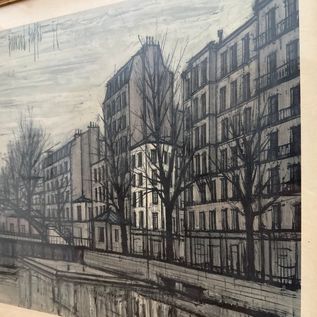 A striking mid-century Paris scene rendered in the angular, expressive style associated with Bernard Buffet. This vintage...