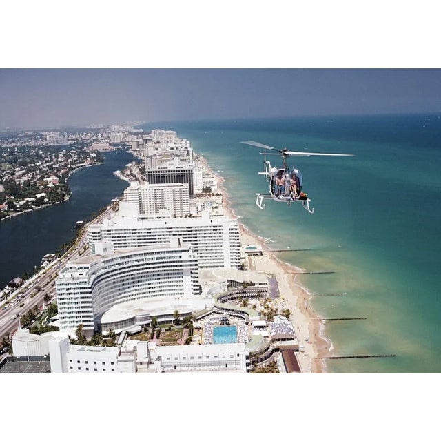 Aerial Miami Beach 1972 A helicopter carrying tourists hovers over the Fontainebleau Hotel on Miami Beach, Florida, April...