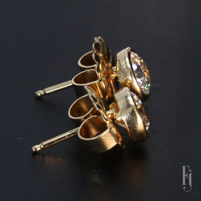 Here are 14k Yellow Gold Stud Earrings with one ~1.0ct. G/SI2 Round White Diamond in each stud. Total Weight - 2.5g