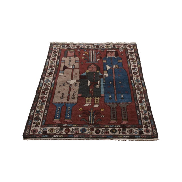 Hand-knotted in wool originating circa 1890-1900, this antique Persian rug connotes a rare Lori rug design, known among...