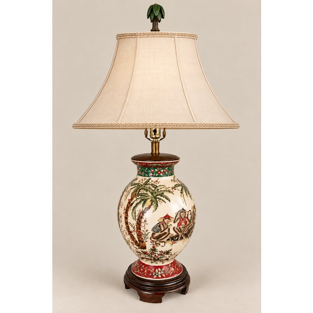 Offered is a stunning vintage Fredrick Cooper Chinoiserie style table lamp. It is hand painted with Fez monkeys, Palm...