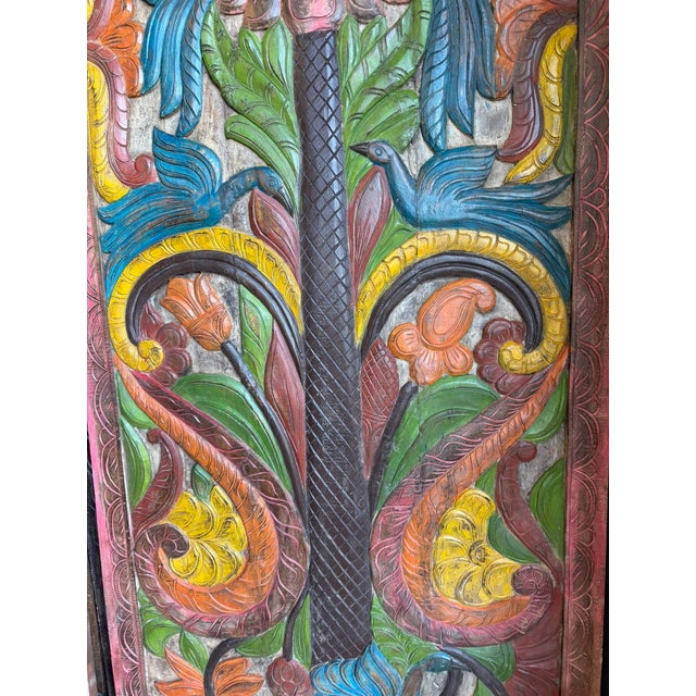 Bring warmth, artistry, and timeless craftsmanship into your home with this hand-painted carved wood panel featuring a...