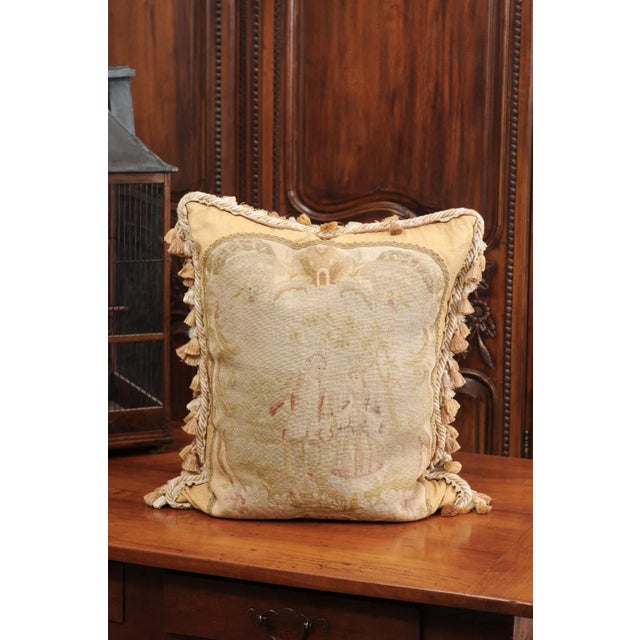 A French needlepoint tapestry pillow from the 19th century, depicting two artistocrates walking in a landscape. Created in...