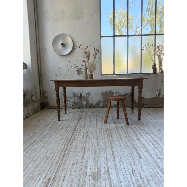Antique small farmhouse table, bistro style, with its delicately turned legs. Made entirely of beech, it has a clean,...