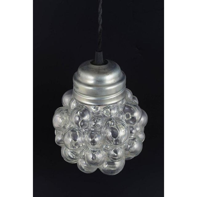 Helena Tynell for Limburg “Bubble” Pendant, 1970s. Classic pendant lamp featuring the iconic bubble-glass shade made of...