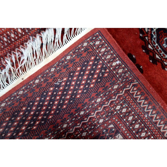 Vintage Uzbek Bukhara Rug | Hand-Knotted Wool | Repeating Elephant’s Foot Motifs | c. 1950s | 3' x 5.1' (91 cm x 155 cm)...
