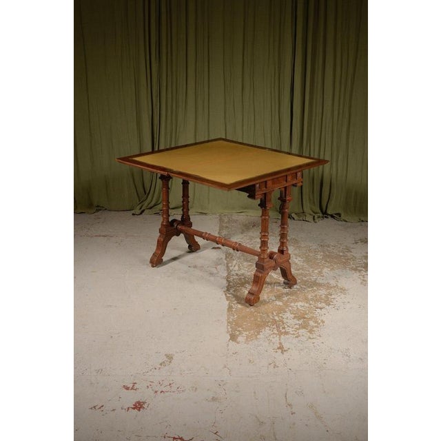 A fine quality Victorian Aesthetic Movement console / card table, the book matched top showing lovely opposing medullary...
