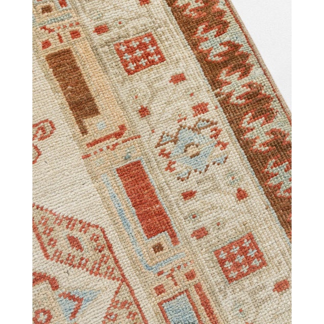 Serab is located on the edge of the Heriz weaving area and specializes in runners. Camel borders are standard on antique...