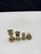 A set of 7 Antique solid brass scale weights. The set features three barbell weights and 4 disc weights. The barbell...