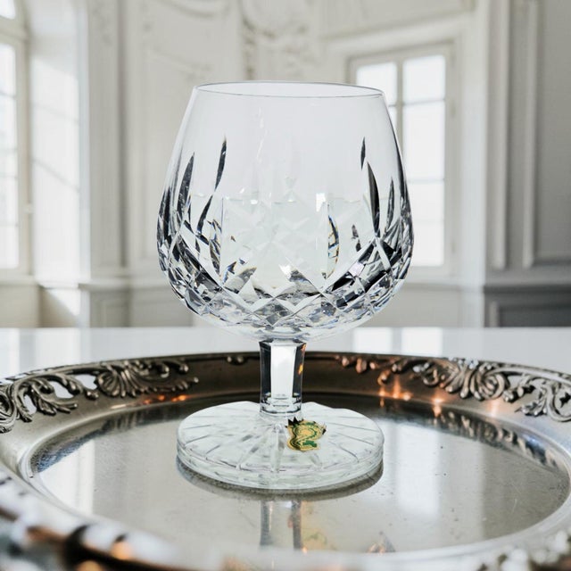 This authentic Waterford Crystal Lismore brandy glass was produced in Ireland during the Late 20th Century, circa...