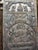 This large hand carved Buddha door panel, featuring a serene Buddha seated on a blooming lotus within a circular medallion...