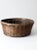 This is a vintage woven reed basket. The decorative woven bowl features an open weave center base. It has a bamboo rim...