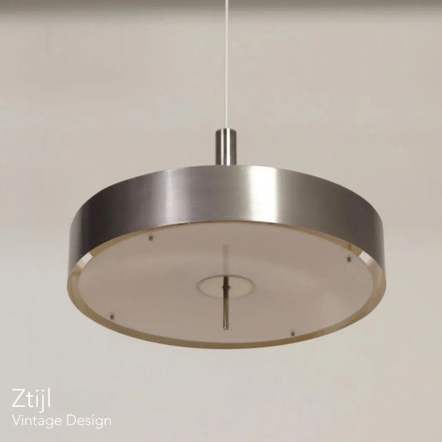 Unique pendant model 266 designed by Louis Baillon for Luminalite, France in 1958. Jacques Biny was the founder of the...