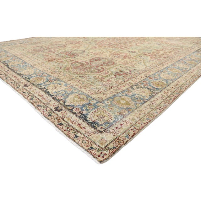 60841 Distressed Antique Persian Yazd Rug with Rustic English Chintz Style 10'02 x 14'09. Balancing a timeless floral...