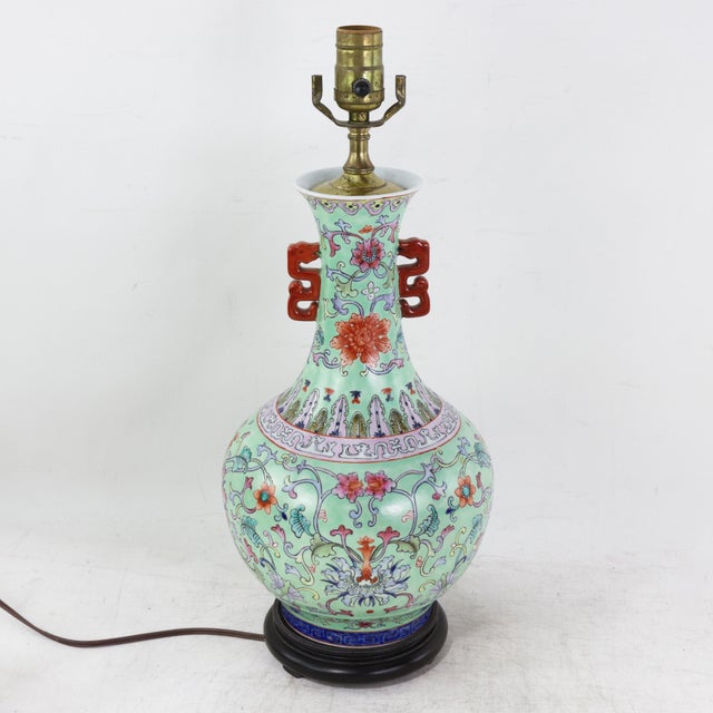 This exquisite vintage table lamp is crafted from a stunning Famille Rose porcelain vase, featuring a vibrant lime green...