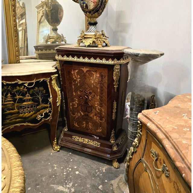 Elevate your interior with this stunning French-style marquetry cabinet, masterfully crafted with intricate floral inlay...