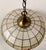 Here is a beautiful vintage capiz shell pendant light, likely dating to the 1960s–1970s. It features a saucer-shaped shade...