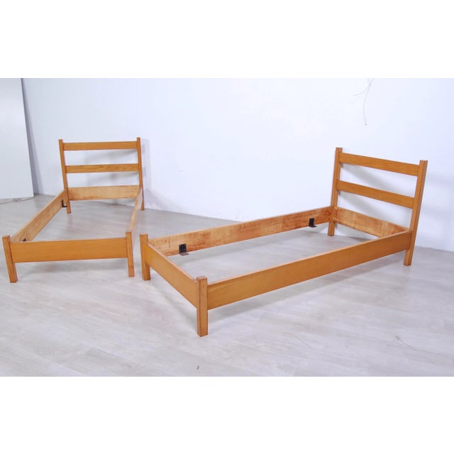 Pair of single bed structures, Italian manufacture dating back to the 60s. Made entirely of light oak wood with very...