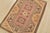 An authentic vintage tribal Milas rug hand-knotted with fine wool and natural dyes. This oriental rug features a small...