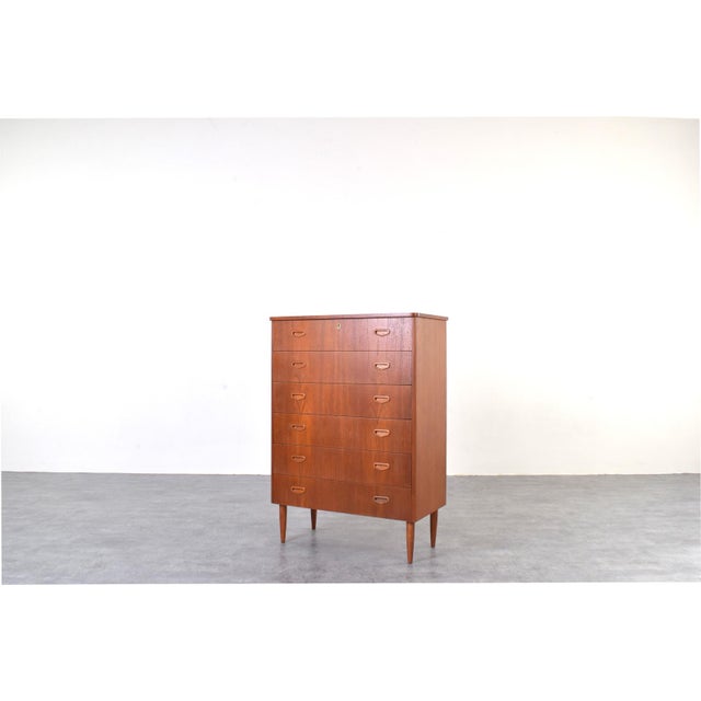 This teak chest of drawers was manufactured in Denmark in the 1960s. The furniture has been professionally and carefully...