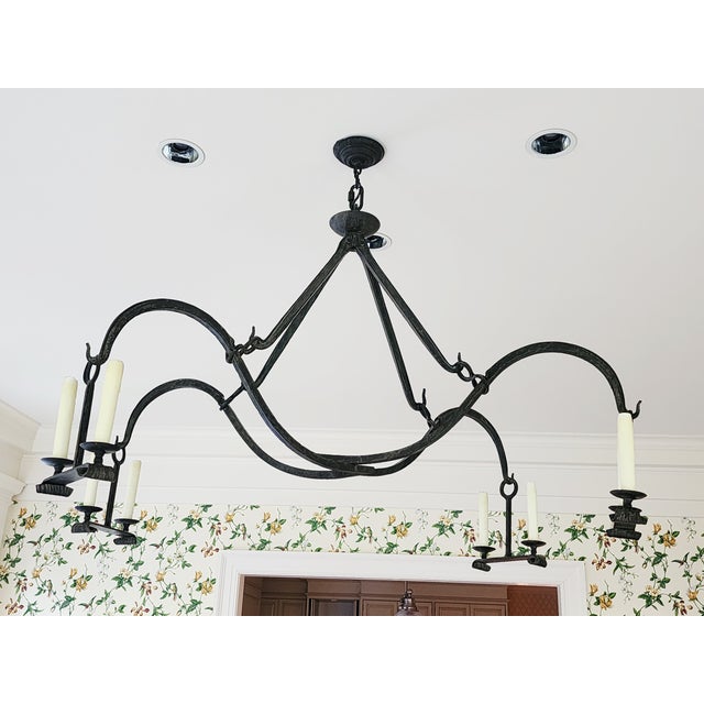 Fabulous Gothic style handcrafted wrought iron chandelier by Dennis & Leen, Los Angeles. Unique and spectacular form with...