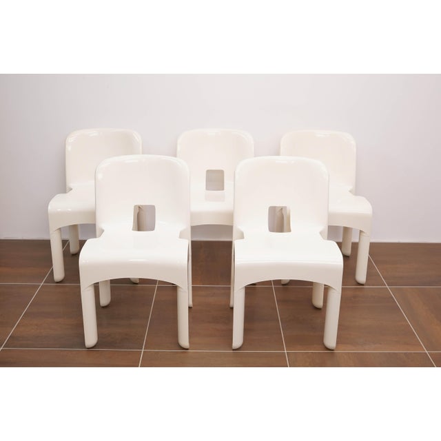 Rare original set of five Universale 4869 chairs, designed by Joe Colombo for Kartell, dating from 1973. The chairs are...