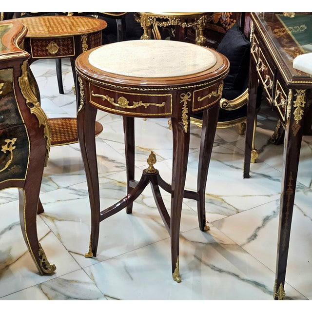 Bring classic French elegance to your interior with this beautiful Louis XV-inspired side table, featuring a rich wood...