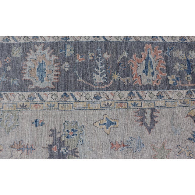 Modern Oushak Rug With Slate Blue Border and Colorful All-Over Tribal Motifs For Sale - Image 9 of 15