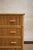 1970s chest of drawers featuring a bamboo structure with drawer fronts covered in woven rush. Fitted with four spacious...