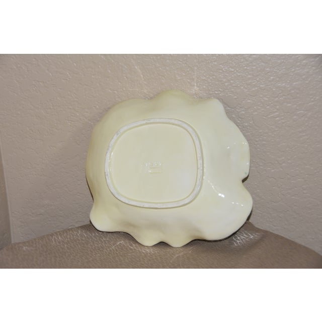 A mid-century Majolica, green and white glazed cauliflower form plate, marked Bordallo Pinheiro Caldas da Rainha, Made in...