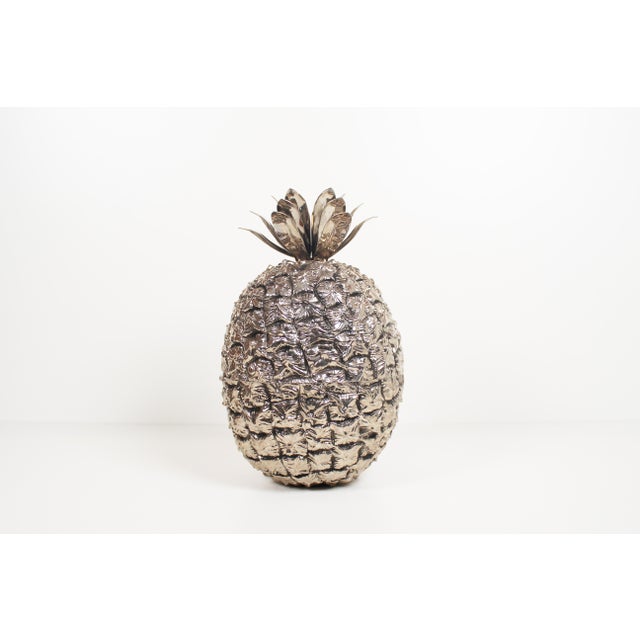 Decorative and unique looking ‘pineapple’ ice bucket by Freddotherm. Silver colored plastic shaped in the texture of a...
