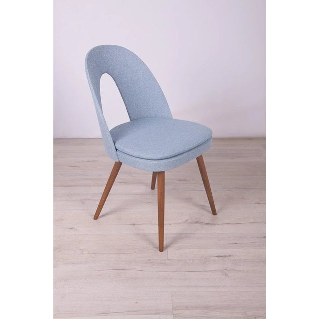 Set of 4 vintage dining chairs by Antonin Suman for Tatra in the 1960s. Wooden elements cleaned. Painted with an oak-...