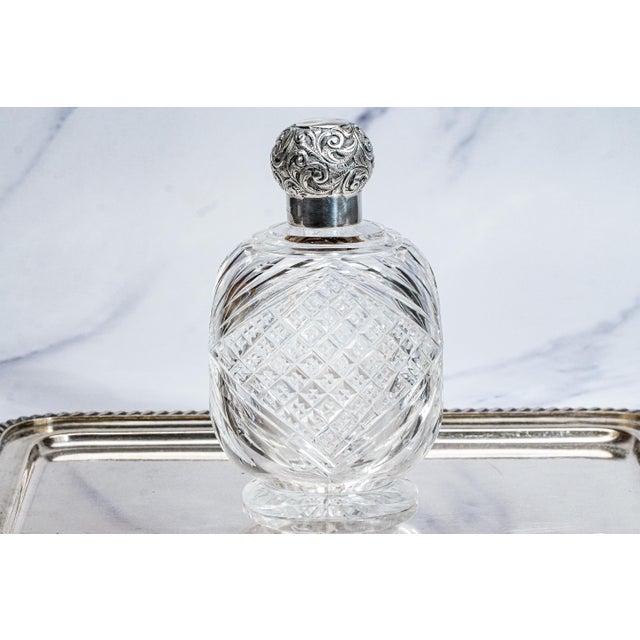A beautiful Edwardian crystal perfume or cologne bottle, exquisitely crafted with both elegance and presence. The heavy...