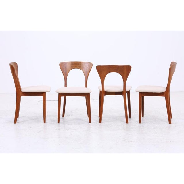 Vintage teak chairs by Niels Koefoed with distinctively shaped backrests and finely crafted details. The organic design...