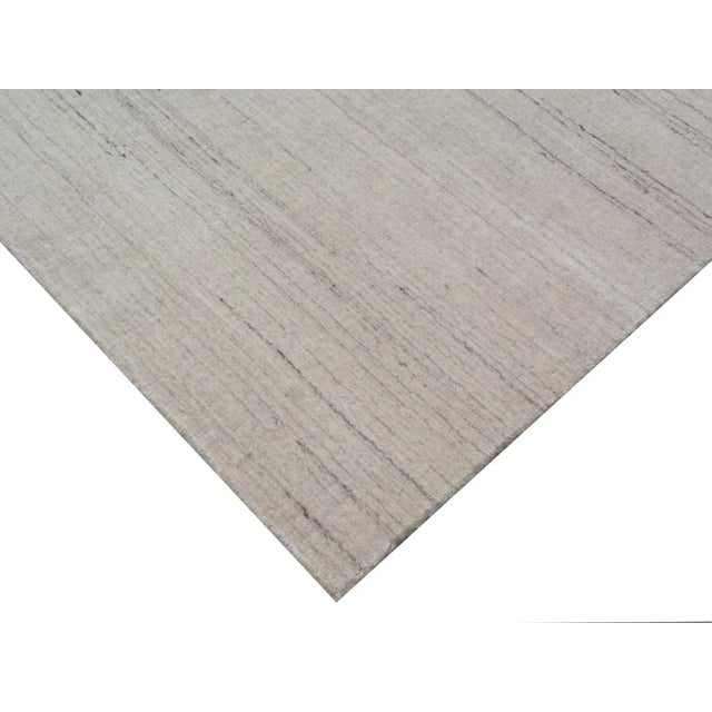 Bring a sense of harmony and balance to any setting with the Banburr Rug. The soft textured pile and beautiful linear,...