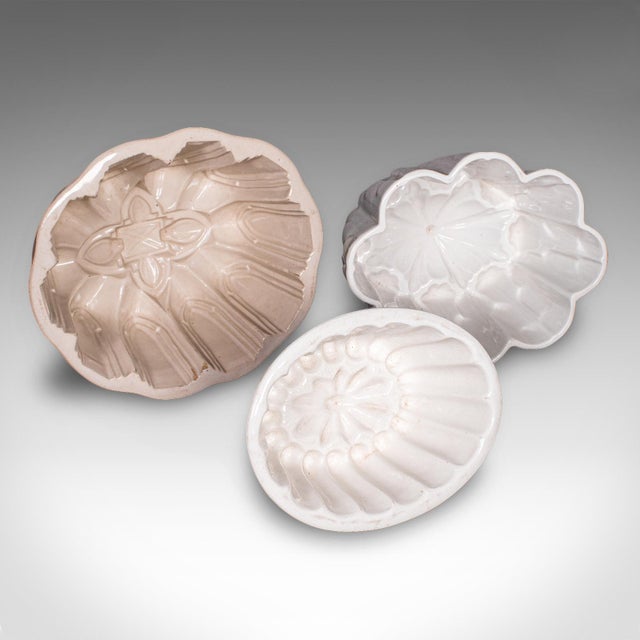 This is a trio of antique jelly moulds. An English, ceramic decorative mould with pattern finishes, dating to the late...