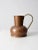 This is a vintage Dutch copper ewer. The well-crafted pitcher features a prominent curving brass handle and no spout....