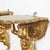 Pair of gilded consoles with cherubs, circa 1800, made of carved and gilded wood from central Italy. The two winged angels...