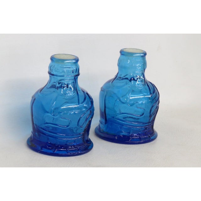 This beautiful Pair of Salt & Pepper Shakers are made of glass. The front glass of both embossed with the following...