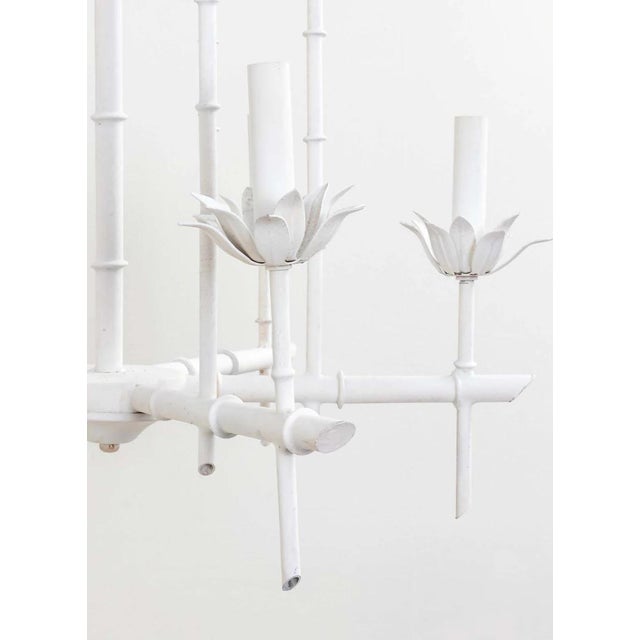 Painted Hollywood Regency faux bamboo pagoda chandelier from Italy. Six arms. Some chipping to paint from age. Original...