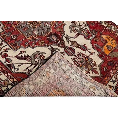 Beautiful vintage Persian hand-knotted wool rug with a red field. This piece has a multi-color accent in an all-over...